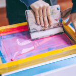 An art student is working on some silk screens in Beijing,China.